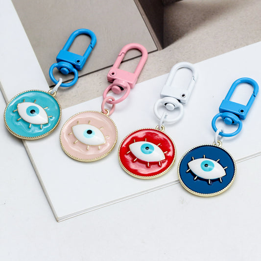 Gantungan Kunci Mata Jahat Bulat Paduan Tidak Ada Kejahatan oleh Yoga Republik